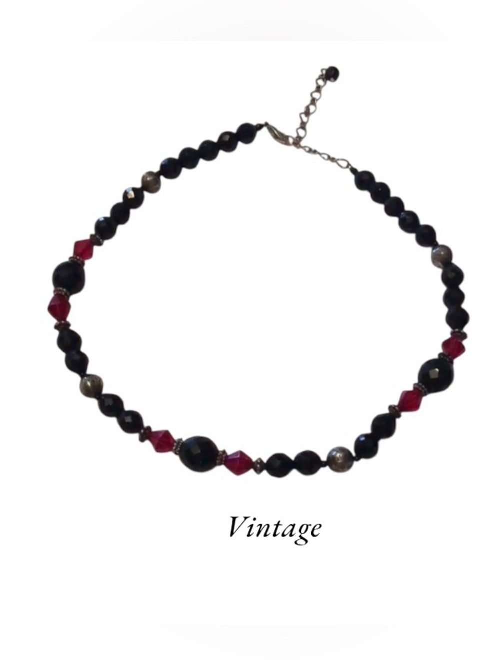 Vintage beaded necklace with red and black faceted beads and silvertone accents.